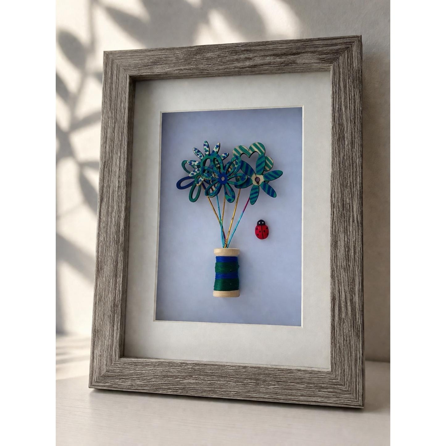 7x5" Wooden & Wire Flowers with Striped Bobbin Reel Framed Picture